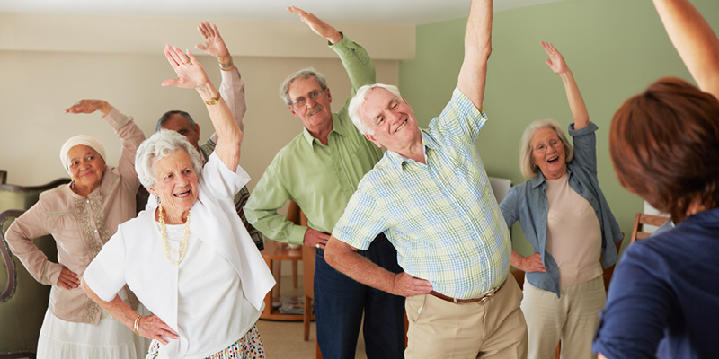 A group of seniors stretching showcasing the positive benefits of exercise